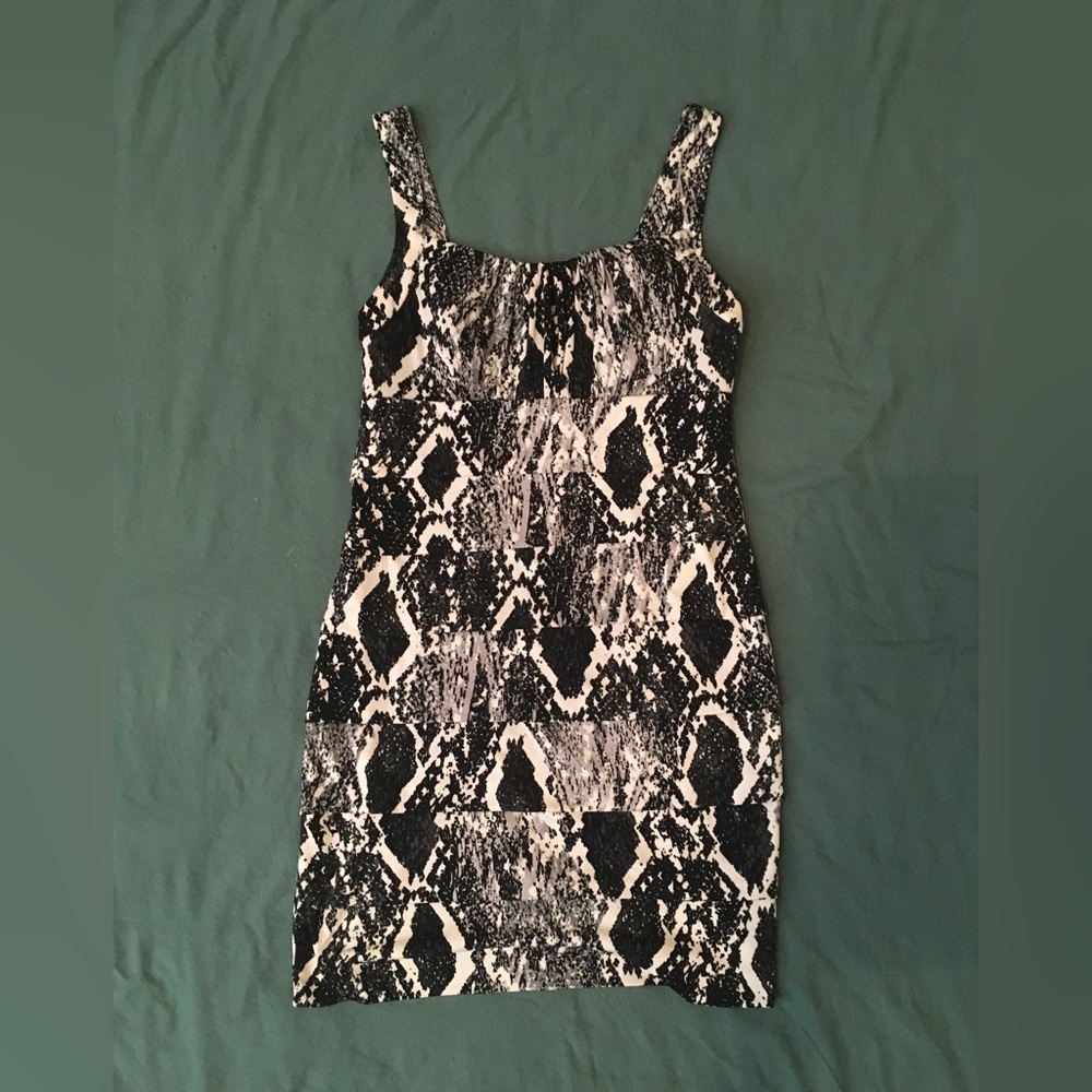 Sweet Storm Black & white snake print mini dress with padded cups. Size: M